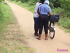 A Nigerian girl with big boobs and a bicycle gets assisted by a man in fixing her bike, leading to some romantic pussy fucking action