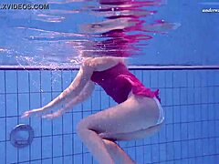 Young Russian babe Elena Proklova shows off her naked body in the pool