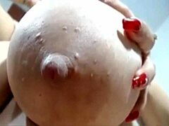 Busty webcam model with large breasts and milk fetish