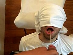 Dirty game of blindfolded man and pissing in mouth